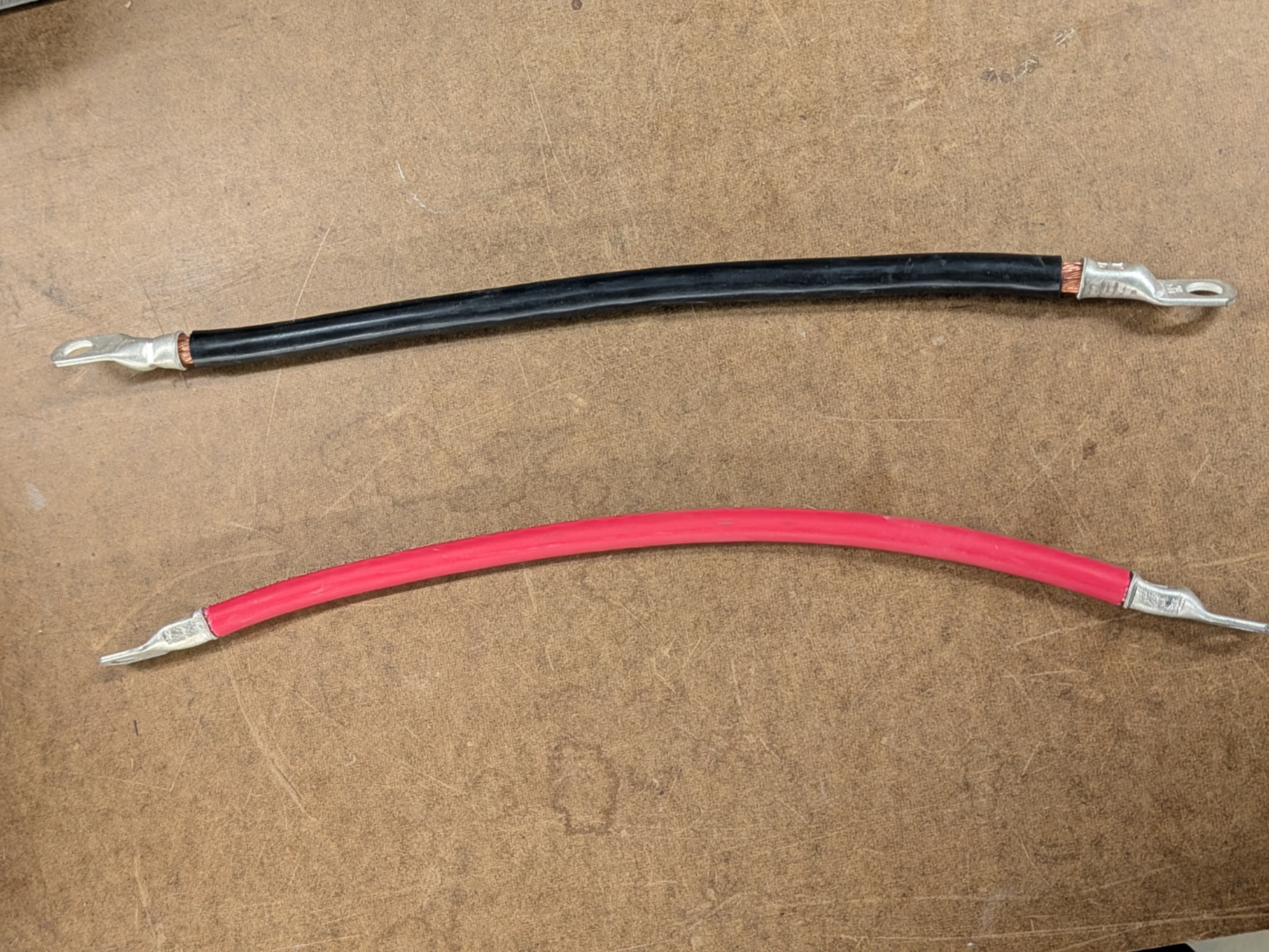 Red and black power distribution and battery cables with lug terminals